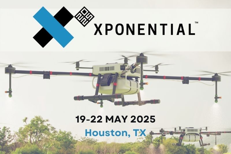 Xponential logo and event dates with a drone in the background